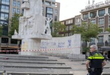 Nationaal Monument op de Dam beklad, twee mannen aangehouden